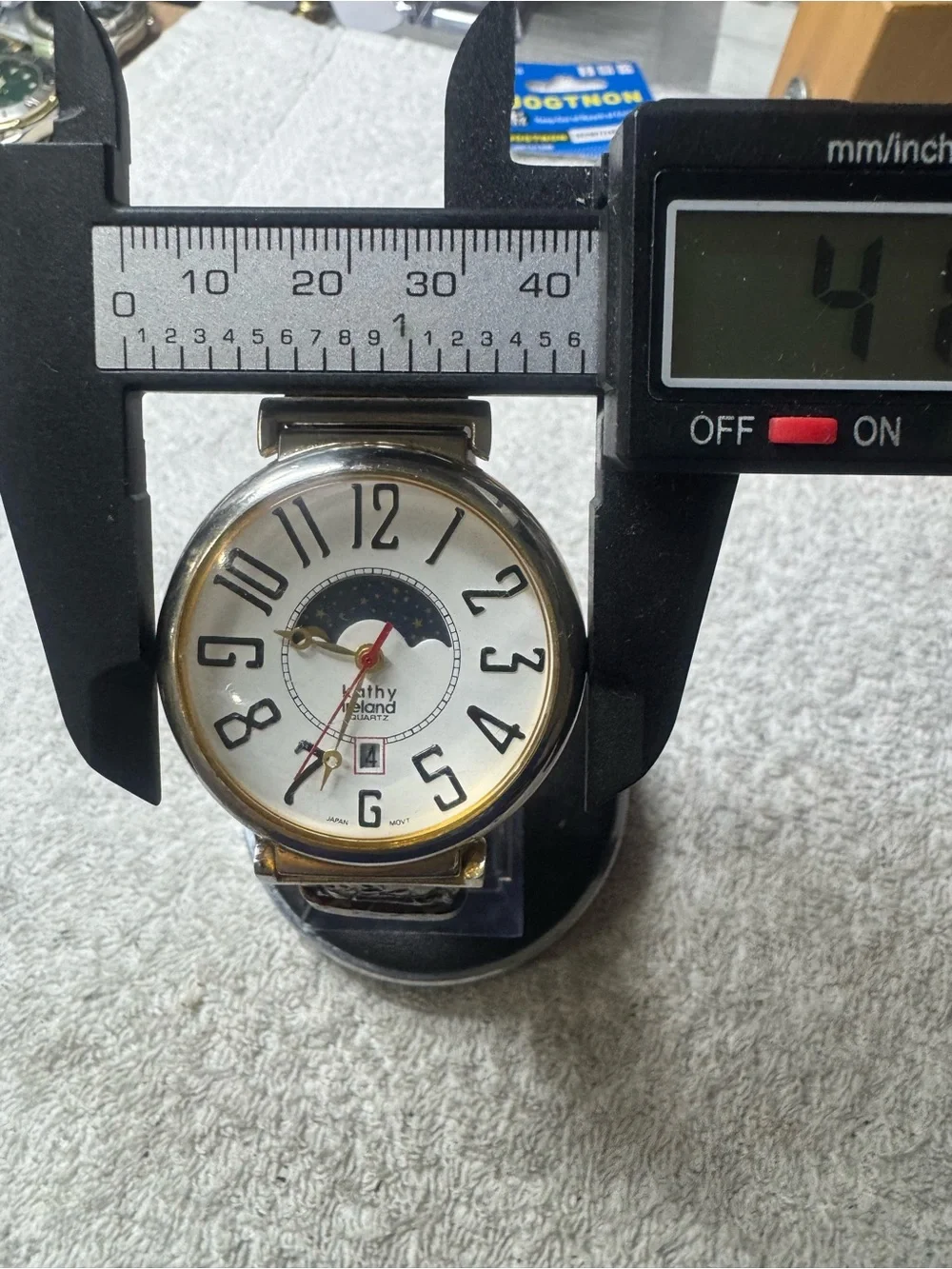 kathy ireland White Dial Moonphase Watch with Gold Accents and Red Second Hand